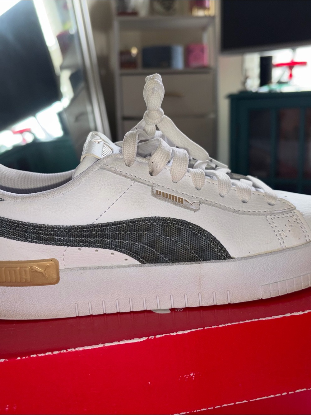 Puma White Sneakers with Black and Gold Accents